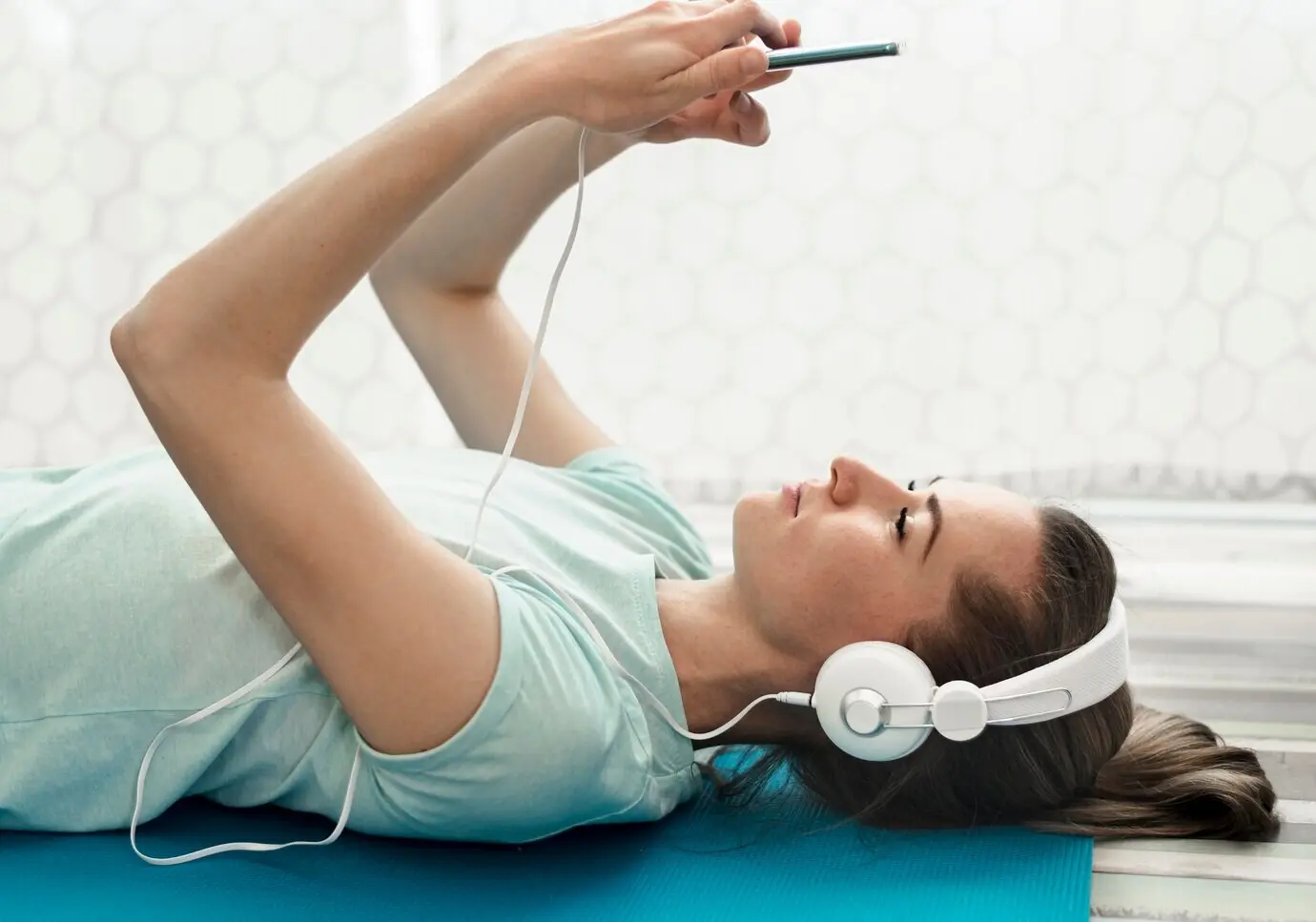 Close-up of an active woman listening to music.